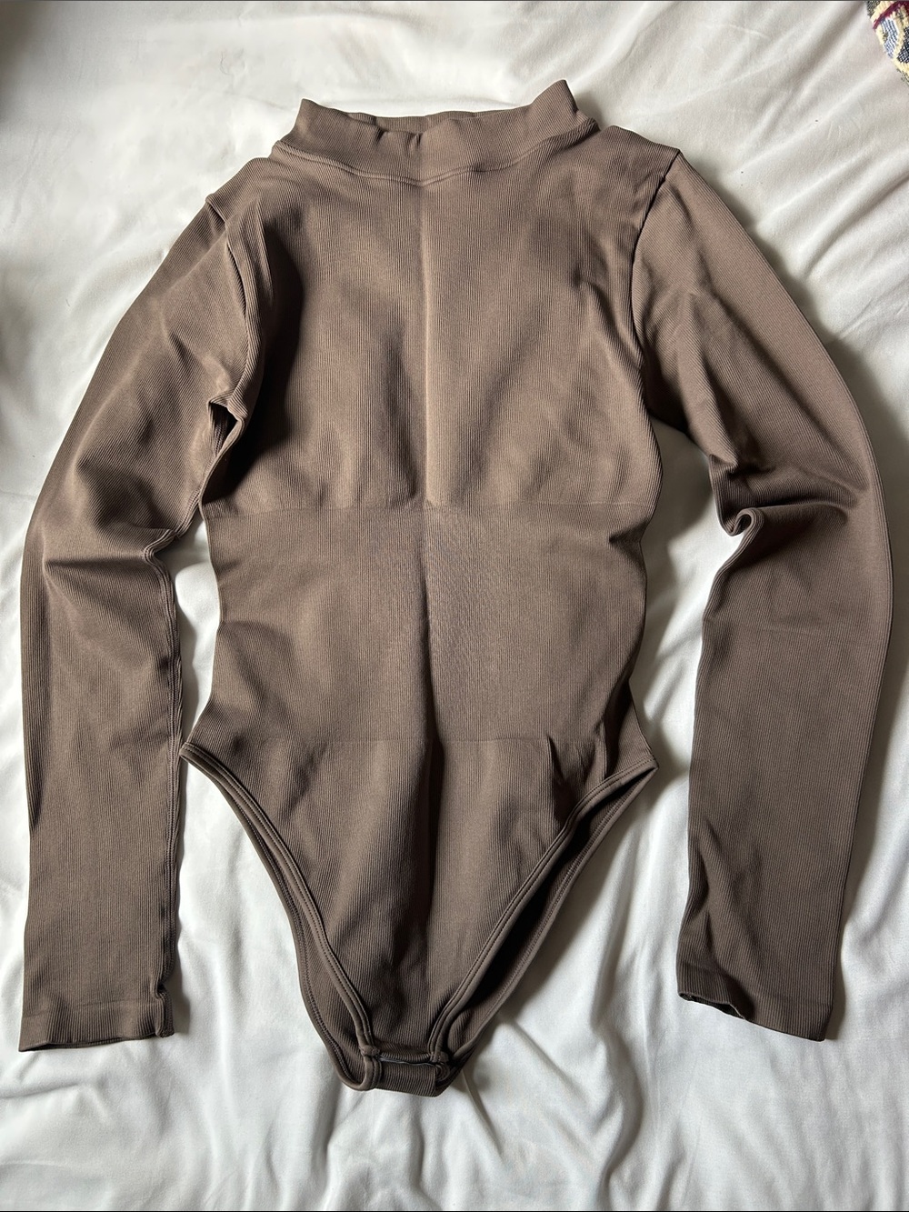 WomanLong-Sleeve Mock Neck One-Piece Bodysuit in Taupe Brown